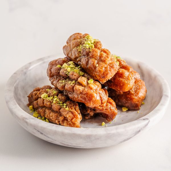Maarcoon – Classic Lebanese fried semolina dough dessert dipped in syrup, crafted to order from our bakery in Sterling, Virginia
