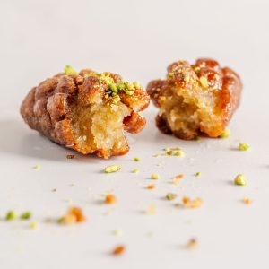 Maarcoon – Classic Lebanese fried semolina dough dessert dipped in syrup, crafted to order from our bakery in Sterling, Virginia